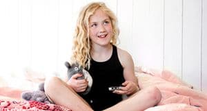 girl with diabetes is happy because she has easy access to her diabetes devices due to clothes with pockets